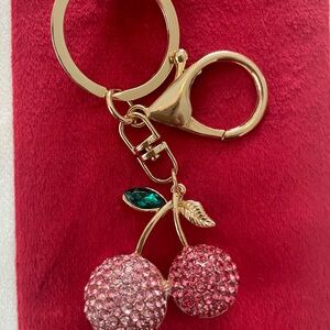 “Pretty Girls Wear Pink” - a super cute, multi-pink colored, cherry, 🍒 charm.